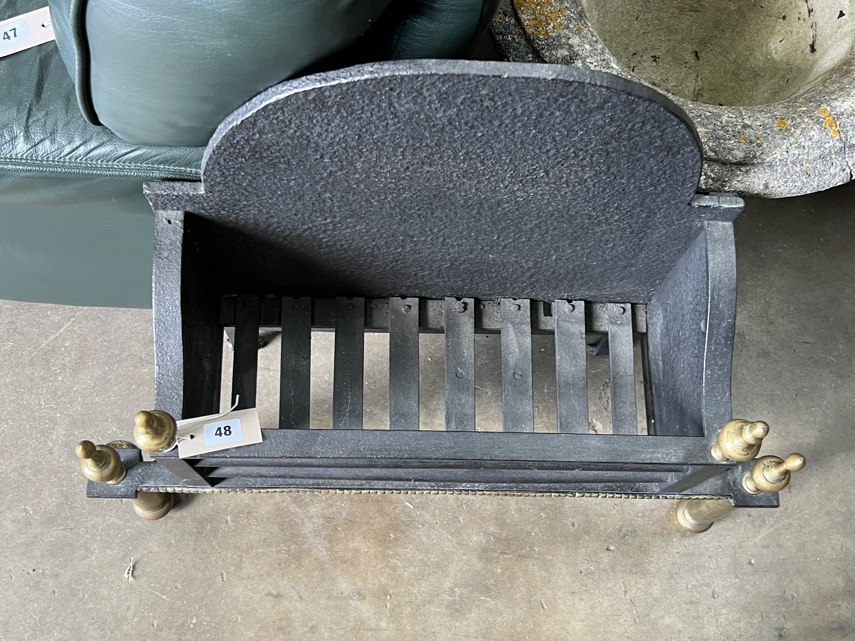 A brass mounted cast iron fire grate, width 71cm, depth 24cm, height 70cm